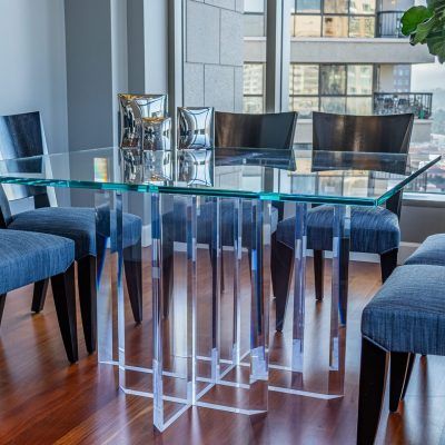 Condo dining area with a glass dining table